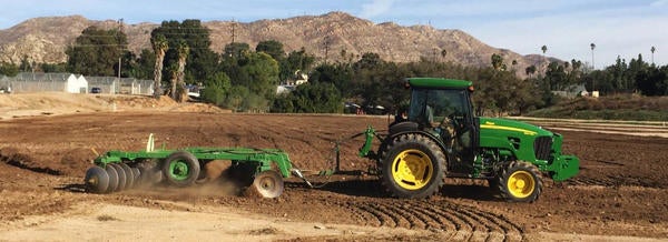 Green tractor on field