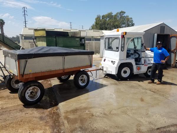 Soil tug and trailer with Ruben posing